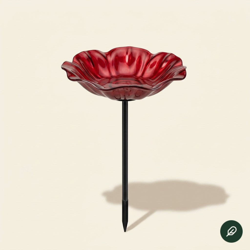 Flower stake bird bath in red on a cream background